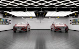 The same garage after renovation, featuring sleek floor coatings, custom storage cabinets, and bright lighting.