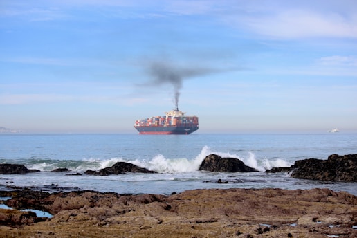 a large cargo ship in the middle of the ocean