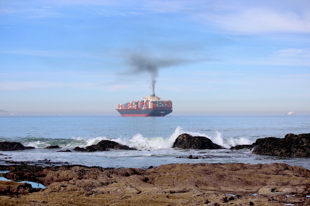 a large cargo ship in the middle of the ocean