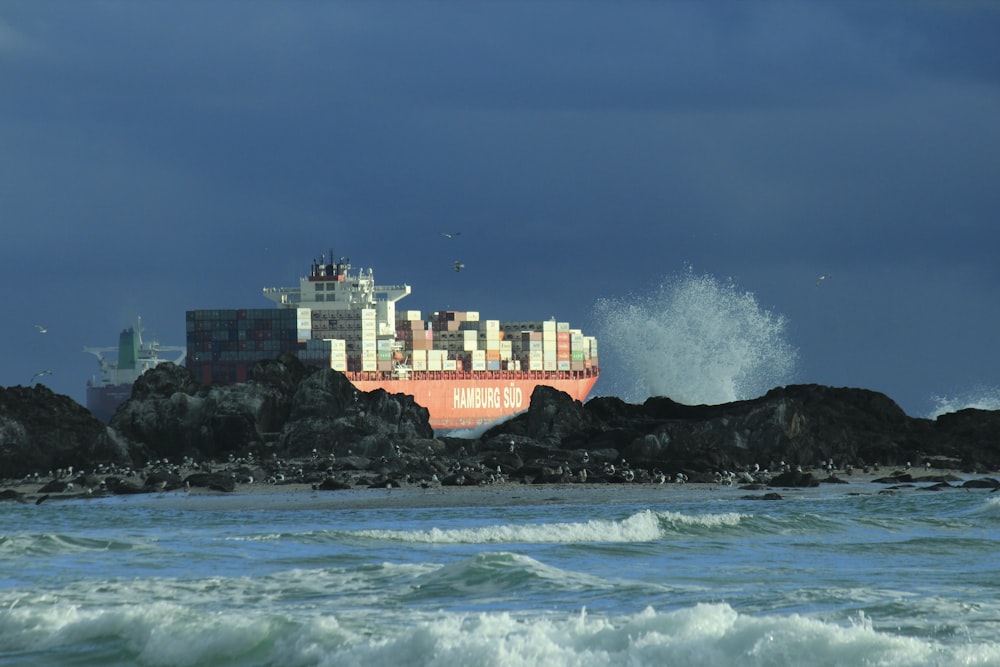 a large cargo ship in the middle of the ocean