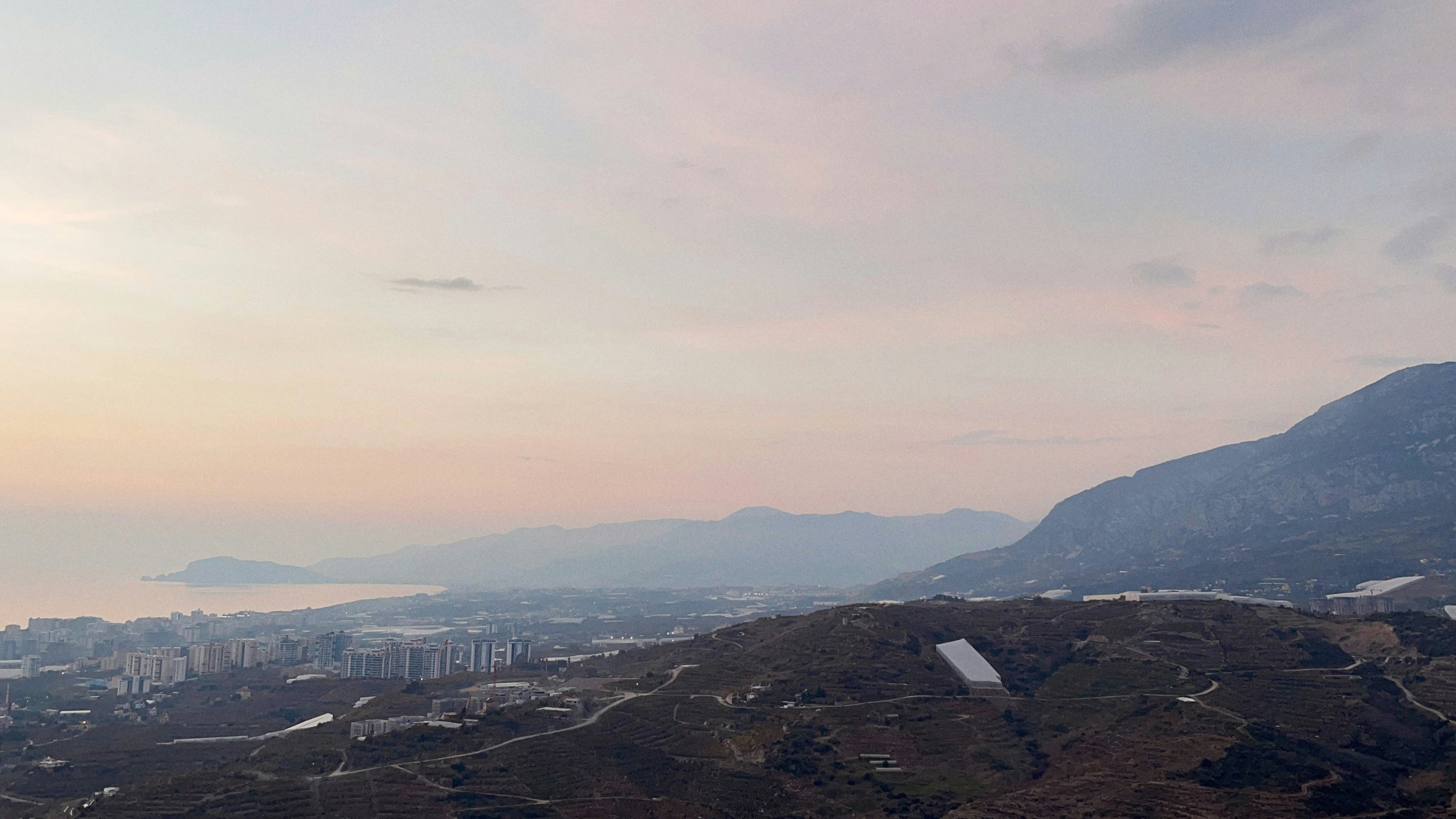 a view of a city from a hill