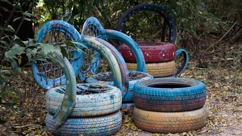 a bunch of old tires sitting on the ground
