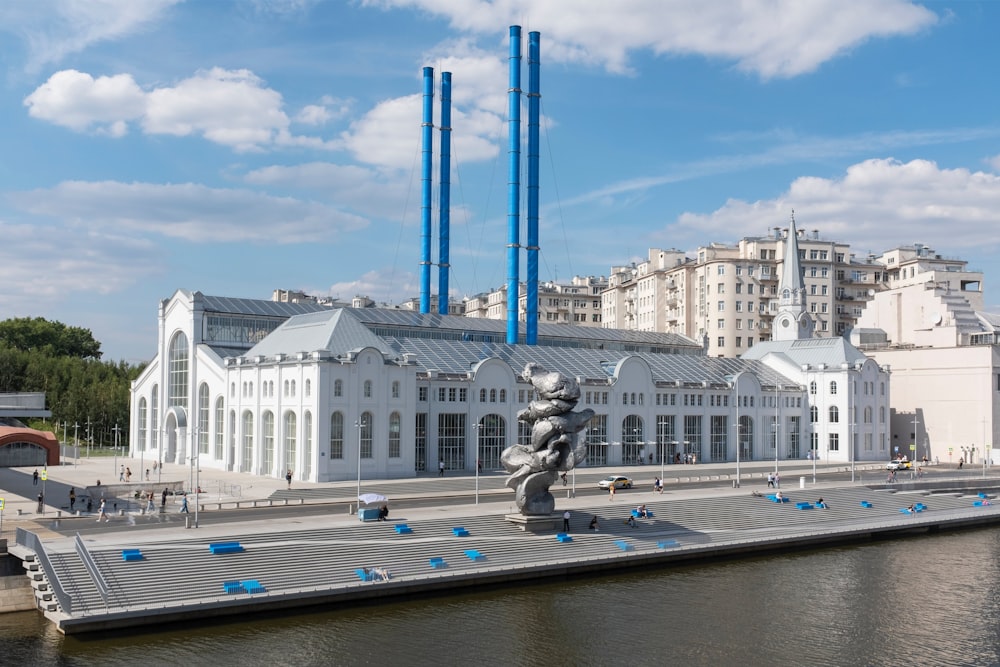 a large building with a statue in front of it