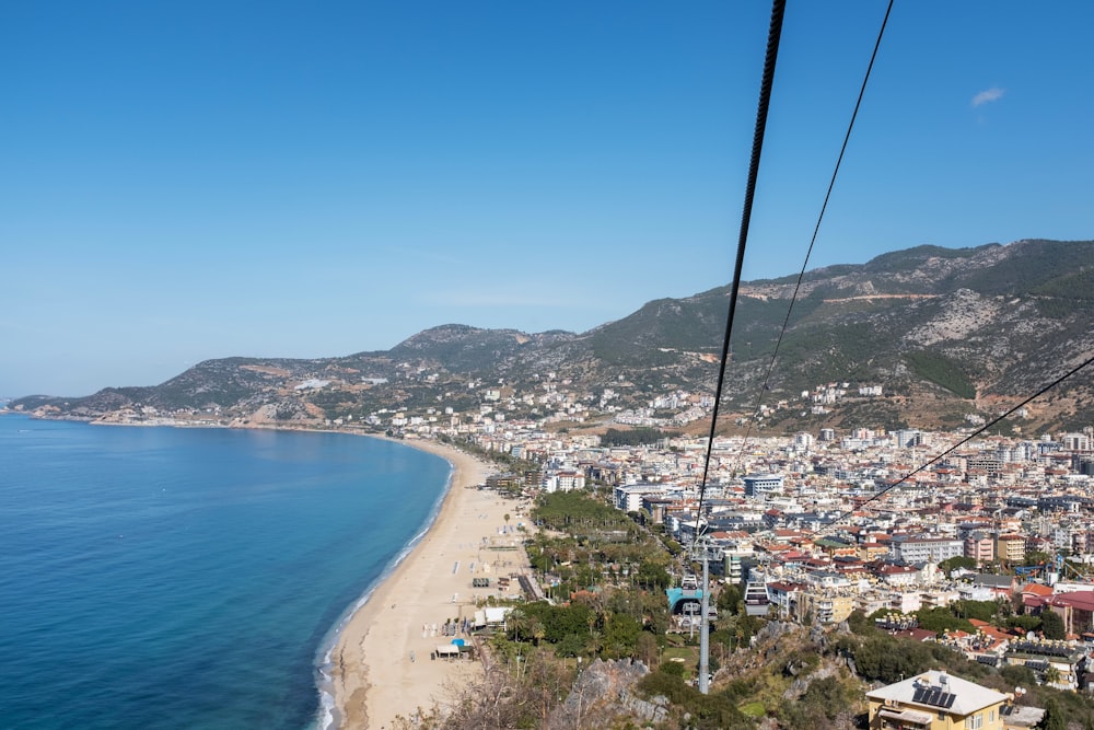 a view of a beach from a cable car