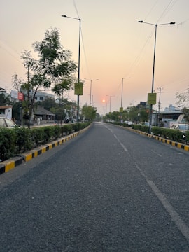 Well-maintained roads and streetlights illuminating the layout at dusk.