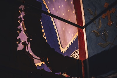 Close-up of an intricately patterned decorative painting showcasing rich textures and colors.