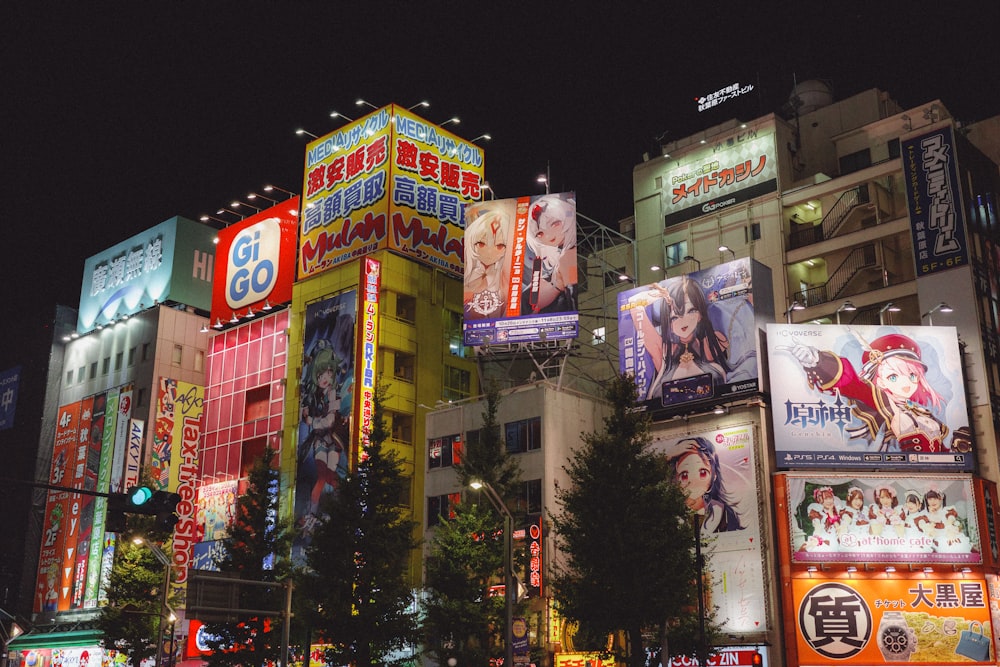 a busy city street at night with a lot of neon signs