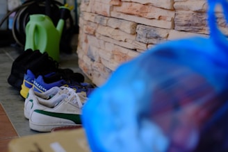 A stylish shoe storage bag with ventilation, holding several pairs of shoes in an orderly fashion.