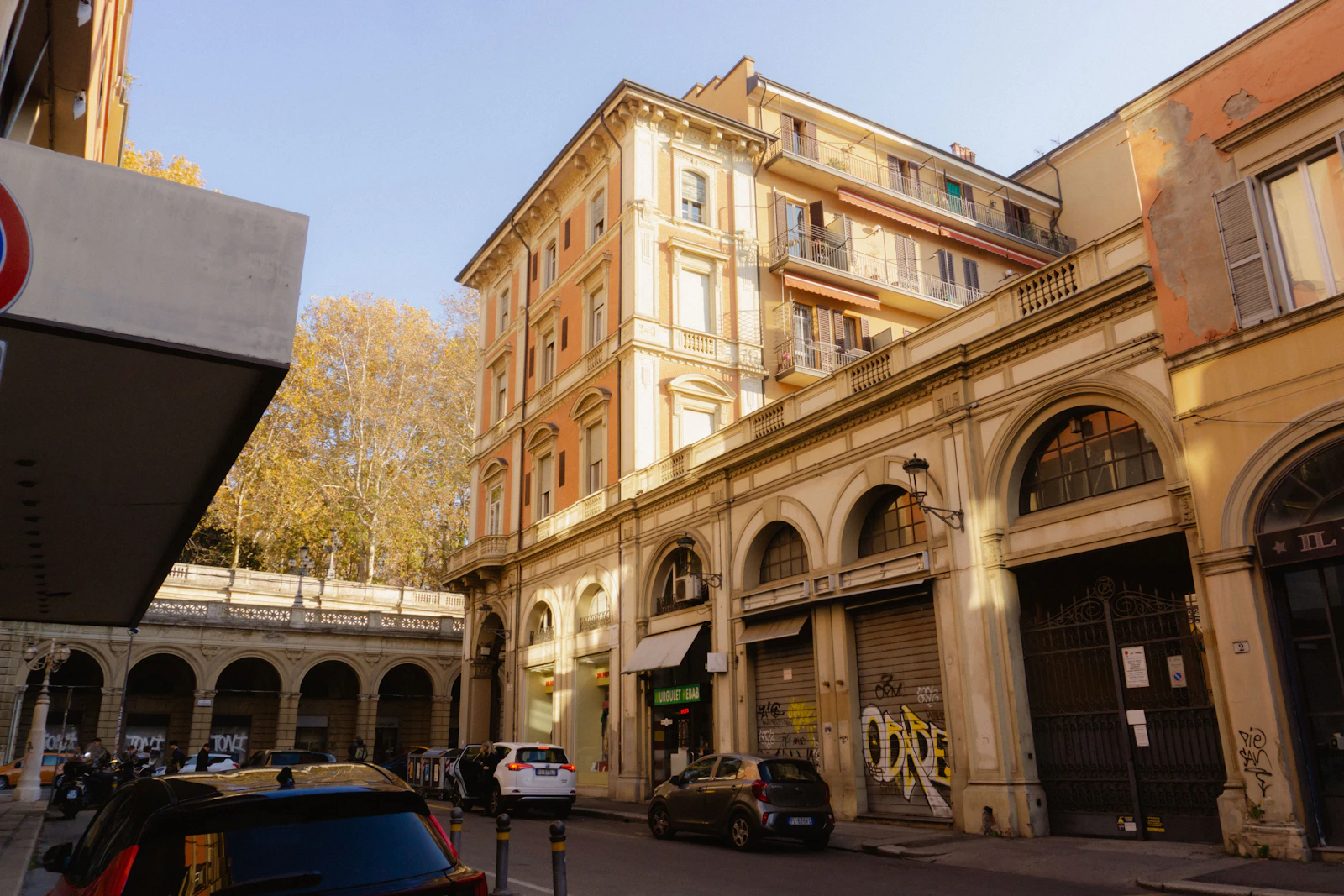 Narrow Italian street with a no-entry sign above the roadway