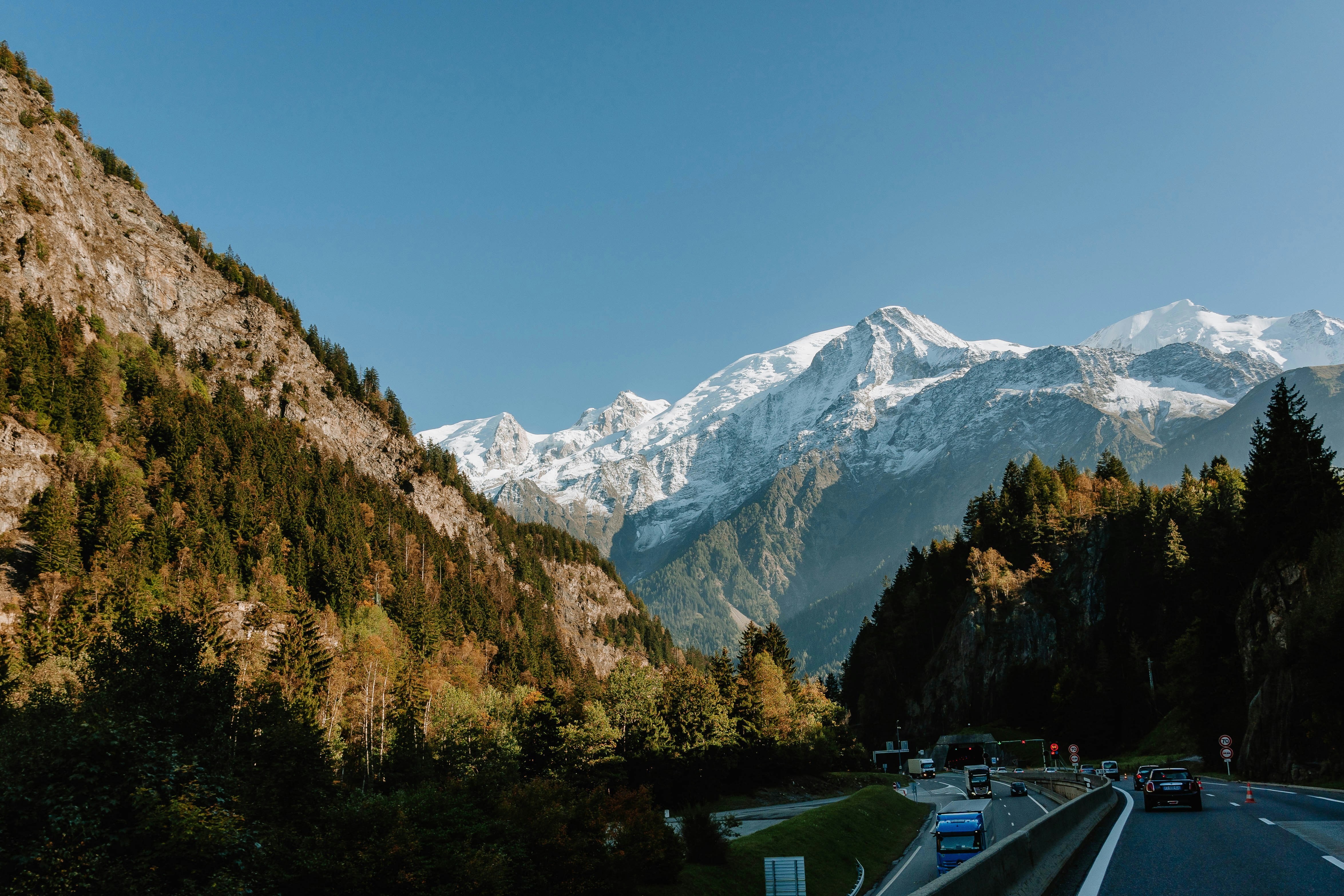 a view of a mountain range from a highway
