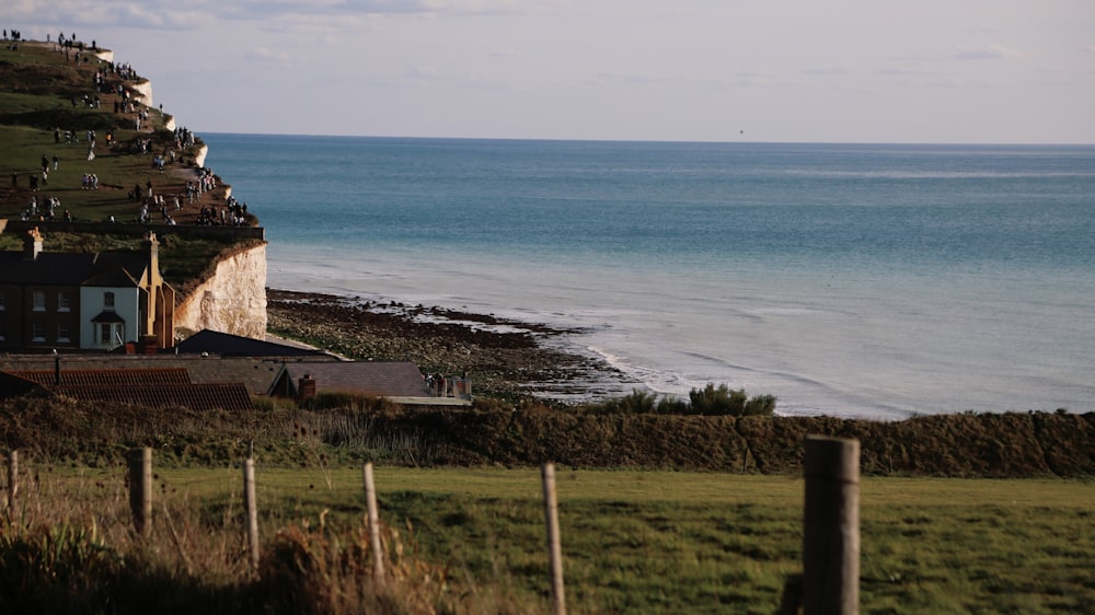 a house on the side of a cliff overlooking the ocean