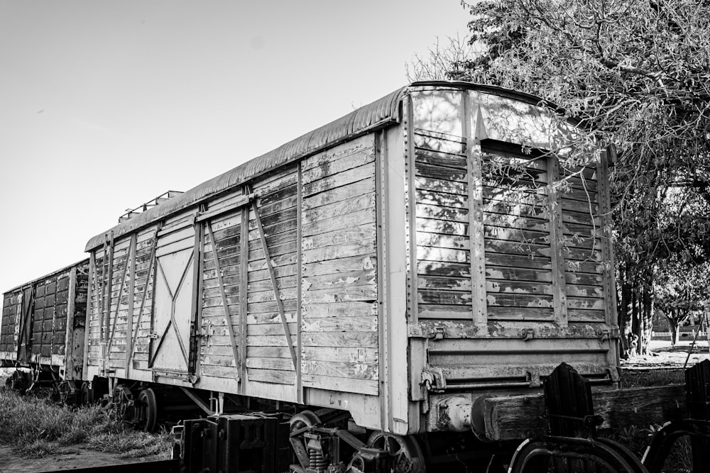 a black and white photo of an old train car