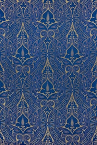 An elegant yantra design with gold and indigo tones.