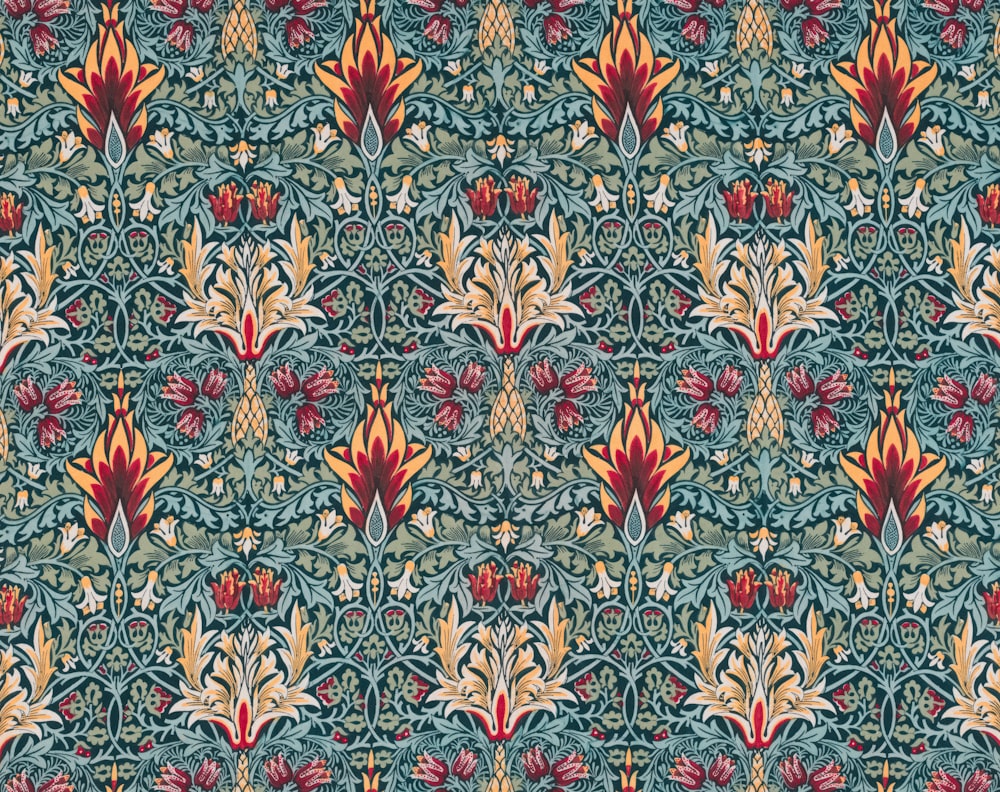 a pattern of flowers and leaves on a blue background