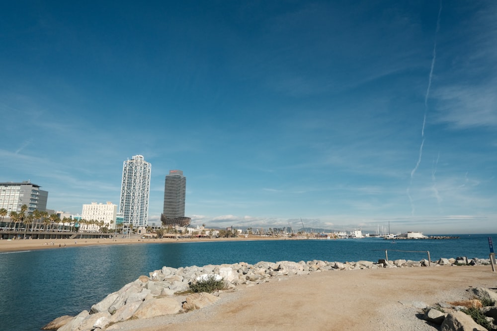 a view of a beach with buildings in the background