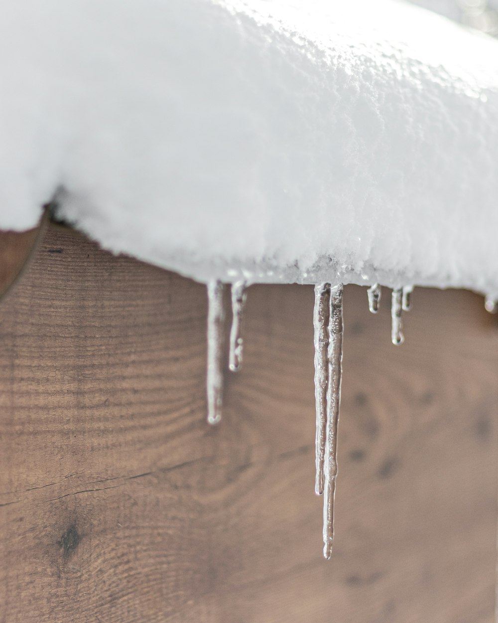 icicles hanging from the roof of a house