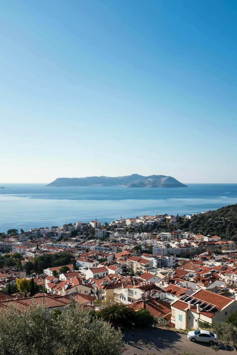 a view of a city with a body of water in the background