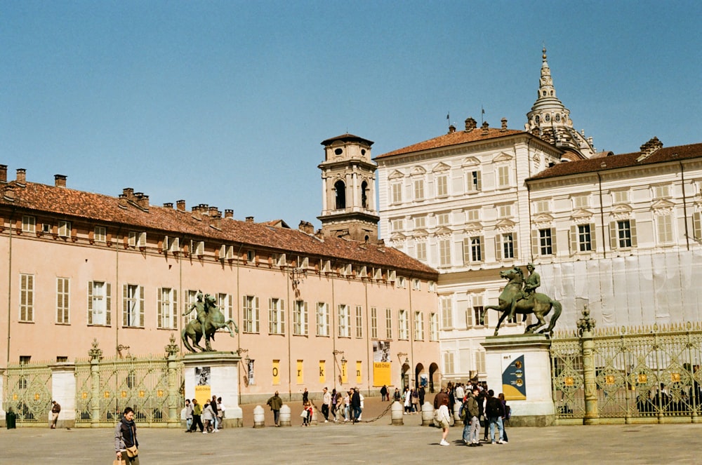 a group of people standing in front of a building