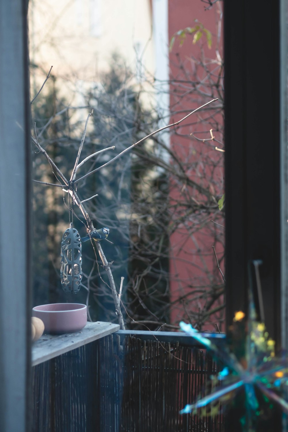 a vase sitting on top of a window sill