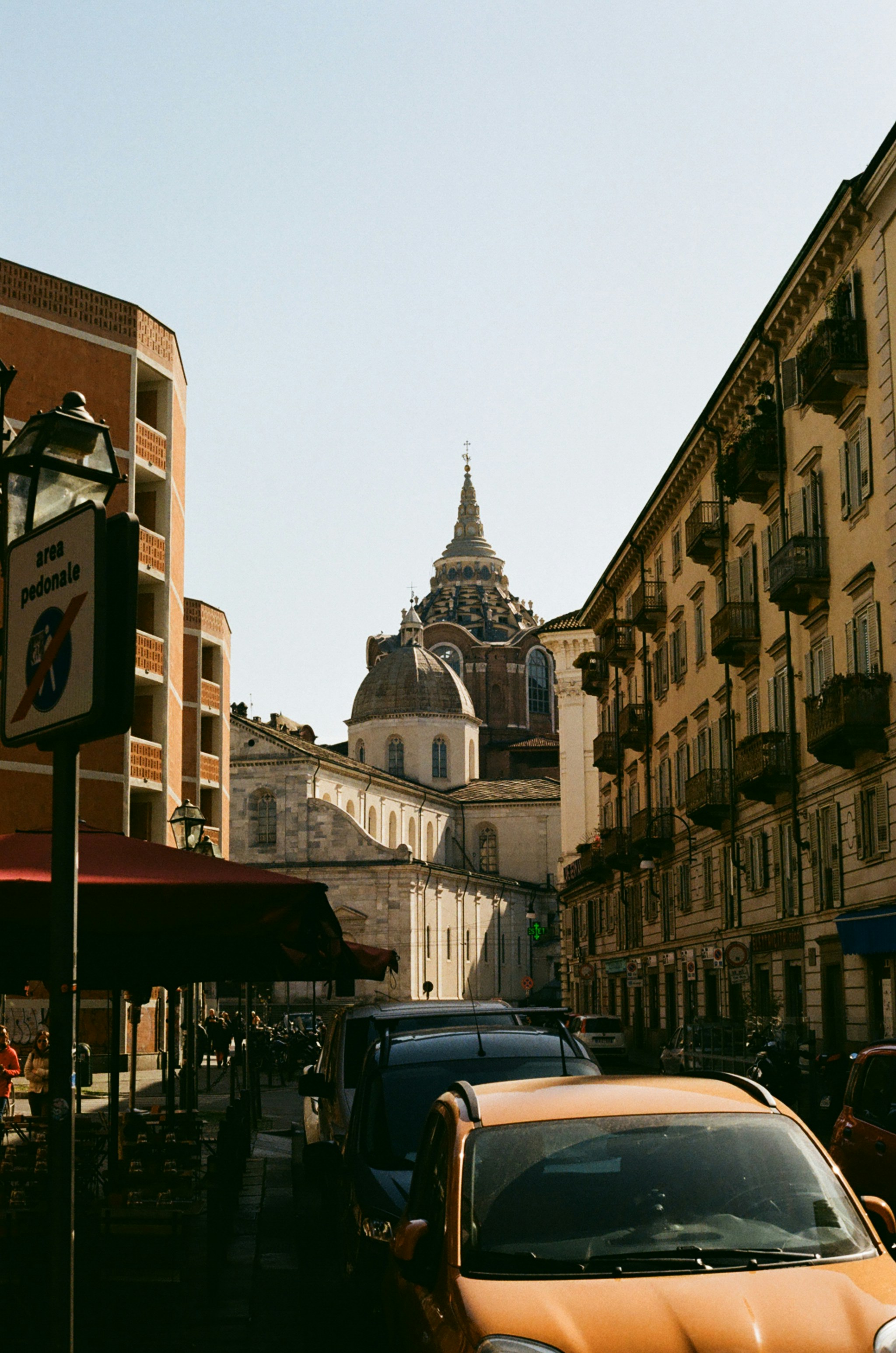 a yellow car parked on the side of a street