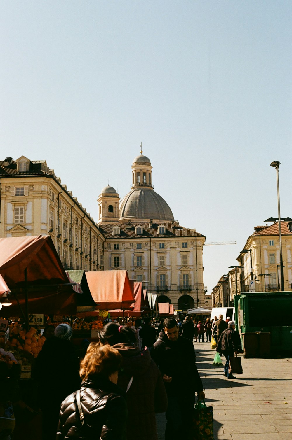 a group of people standing around a market