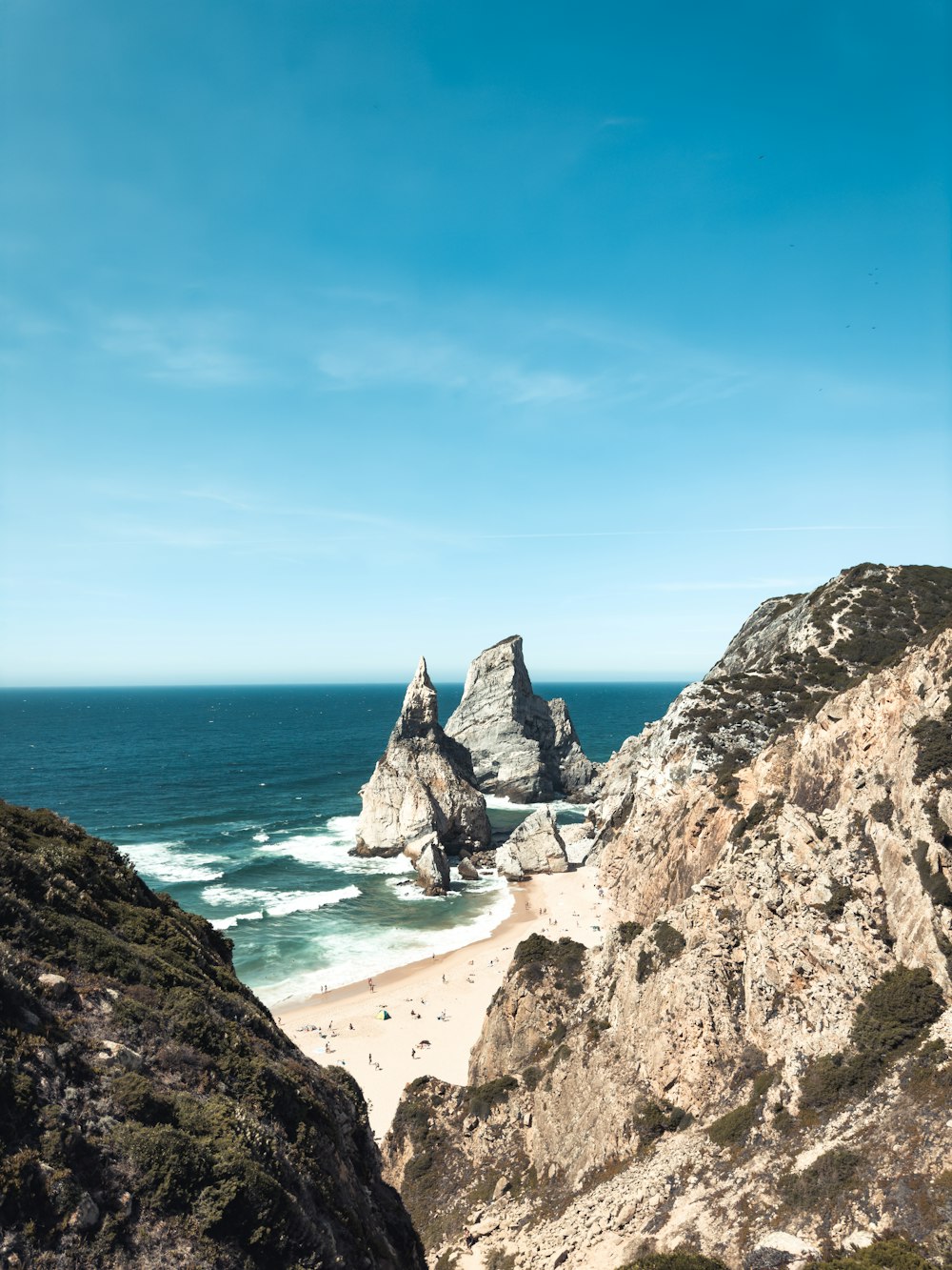 a view of the ocean from a rocky outcropping