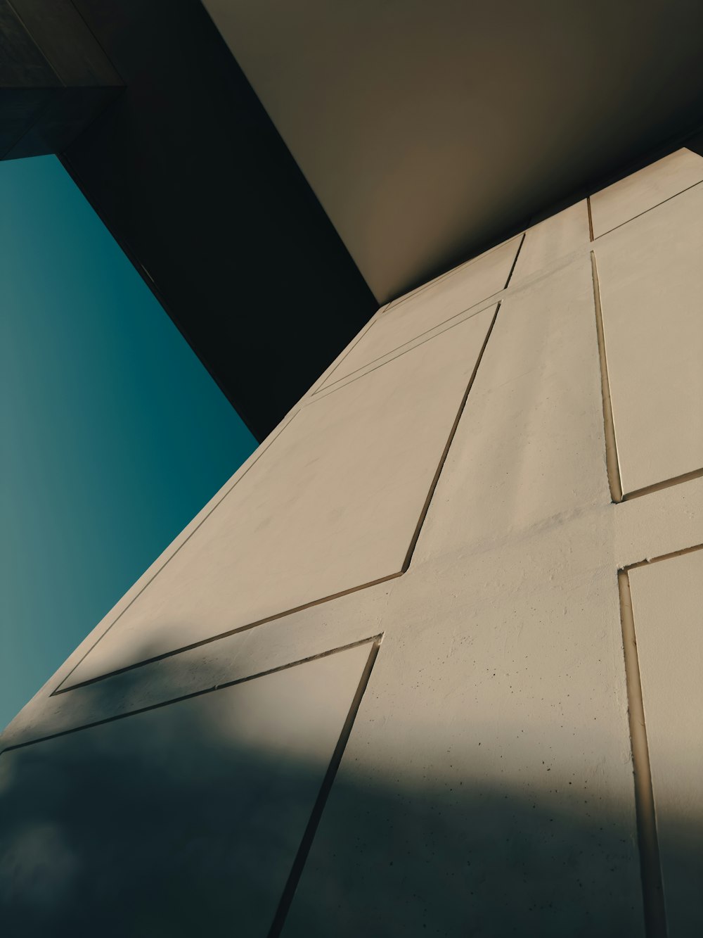 the corner of a building with a blue sky in the background