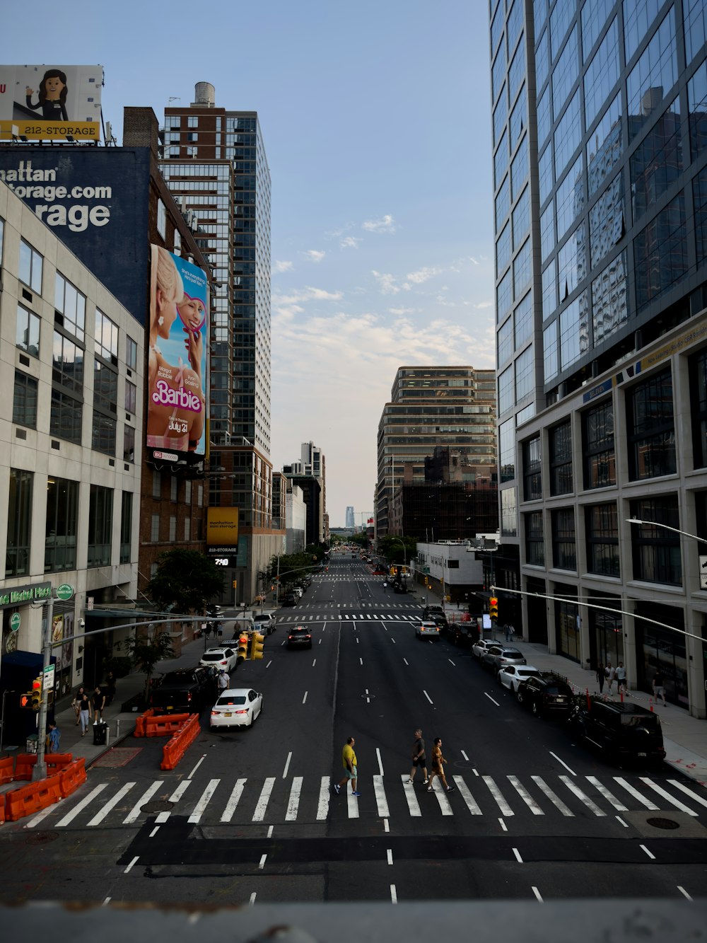 a city street filled with lots of tall buildings