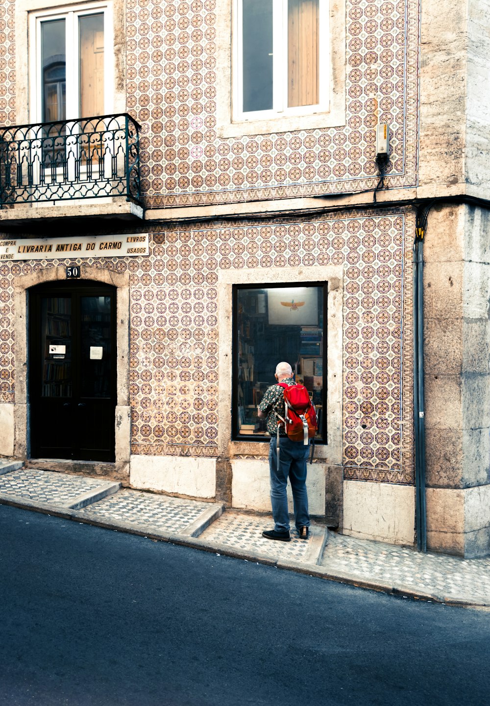 a man is standing outside of a building