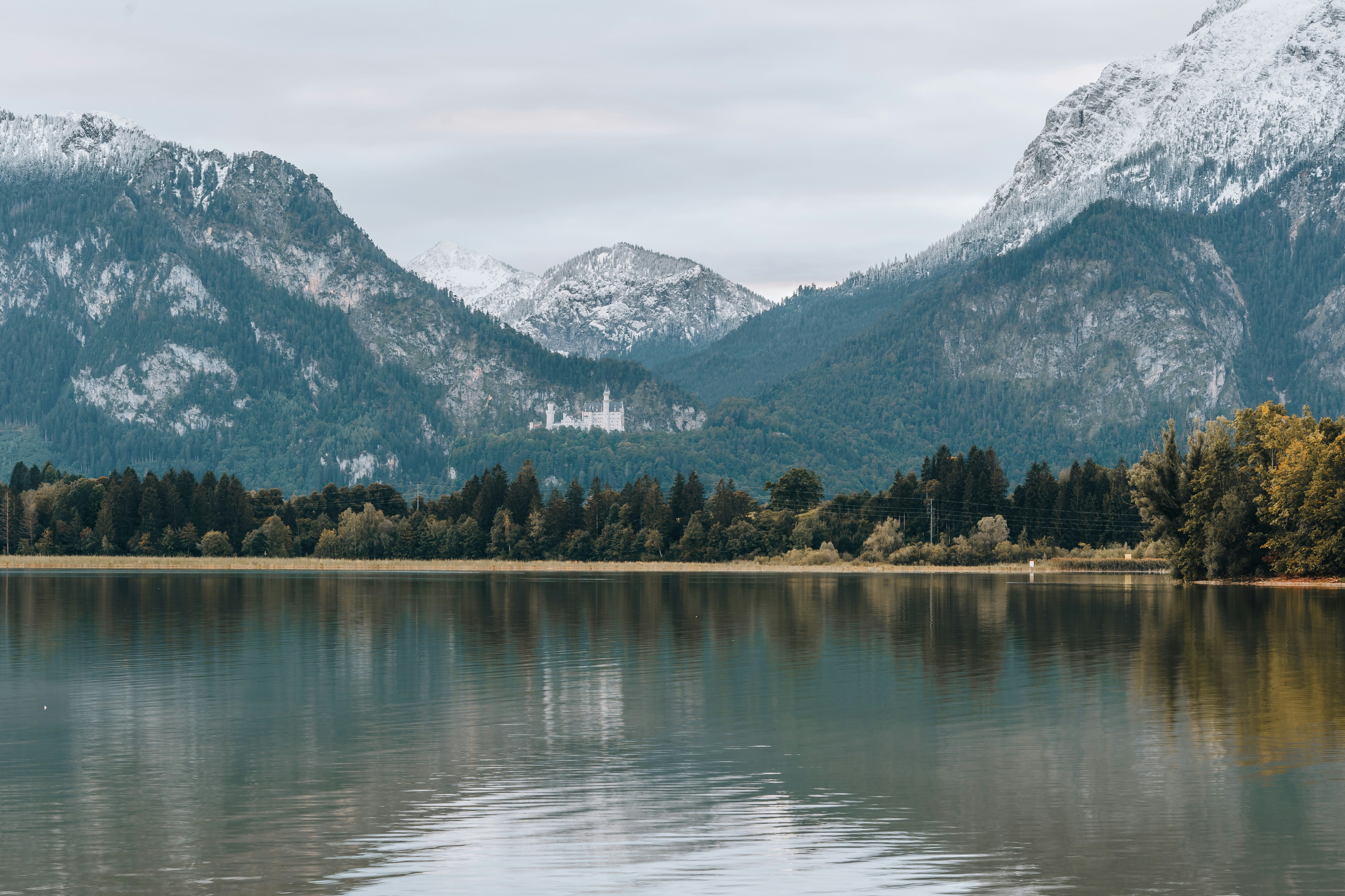 a lake with mountains in the background