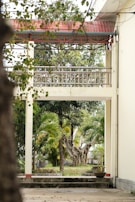 A serene outdoor garden area where elderly residents enjoy fresh air and gentle exercise under supervision.