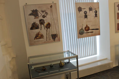 Interactive exhibit showing historical artifacts with digital touchscreens for visitor engagement.