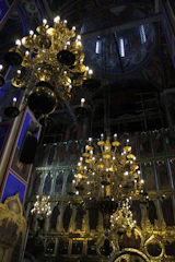 Soft ambient lighting highlighting intricate spiritual artwork on the walls.