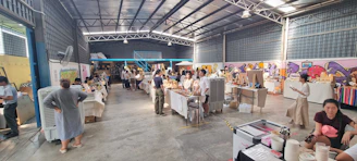 A vibrant exhibition space filled with diverse stalls and engaging displays.