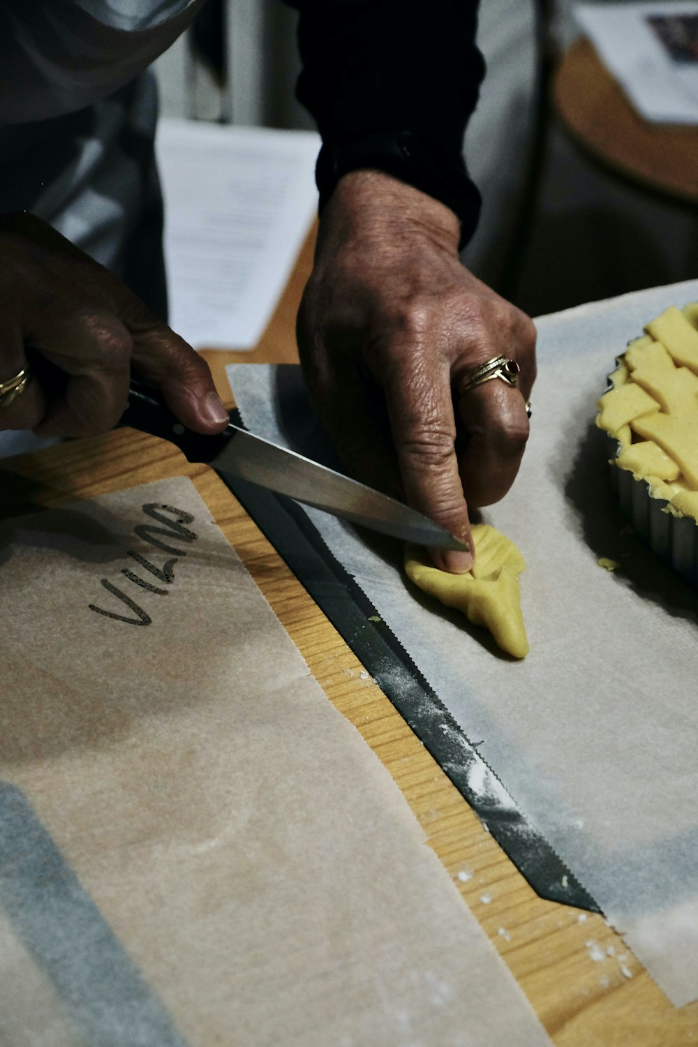 a person cutting a pie with a knife