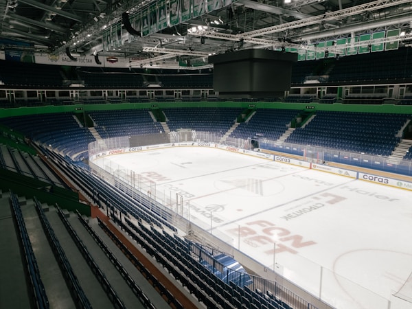 An empty ice rink inside a large arena like City National Arena in Summerlin