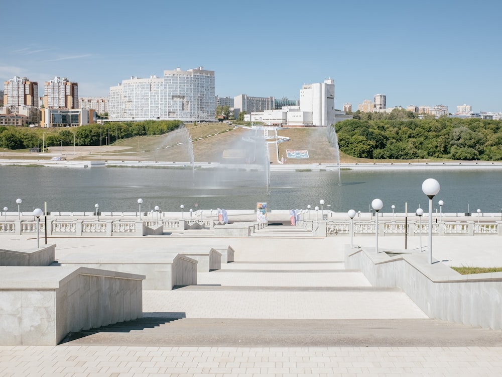 a large body of water with a fountain in the middle of it