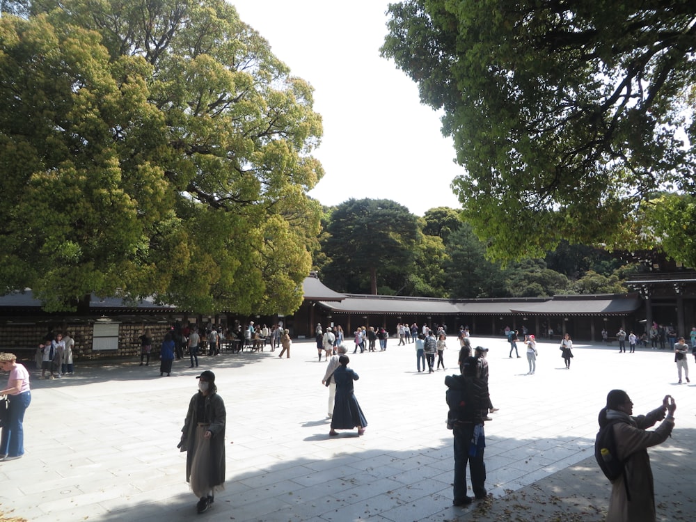 a group of people standing around in a courtyard