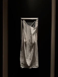 Soft, folded Ihram garments displayed on a gentle fabric background, ready for the sacred journey.