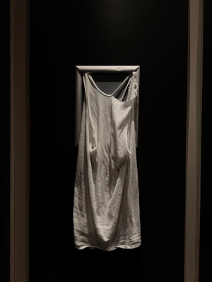 Soft, folded Ihram garments displayed on a gentle fabric background, ready for the sacred journey.