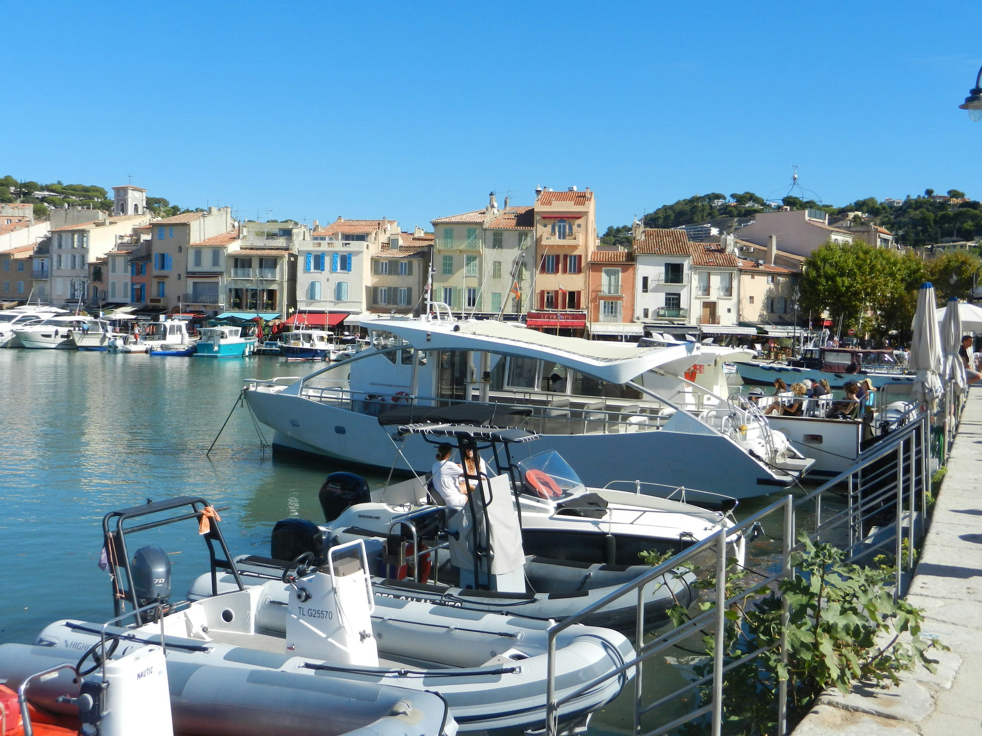 a harbor filled with lots of boats next to buildings