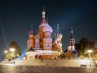 a large building with many spires lit up at night
