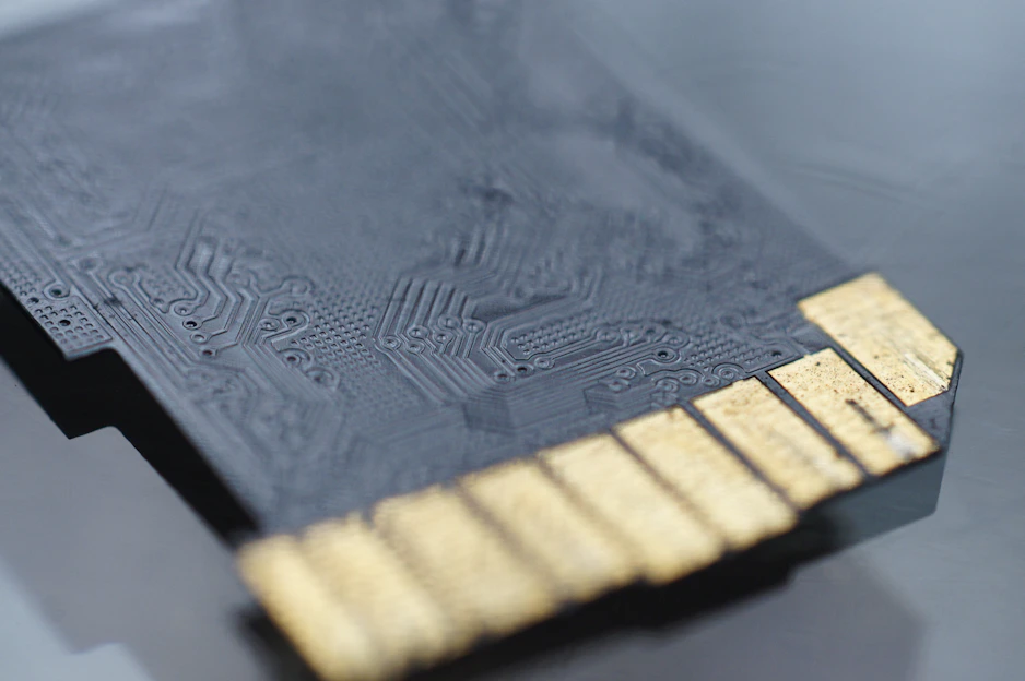Close-up of micro and nano digital technology components arranged on a sleek black surface.