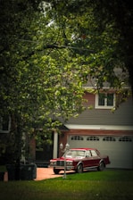 Jill’s bright red driving school car parked near a quiet suburban street.