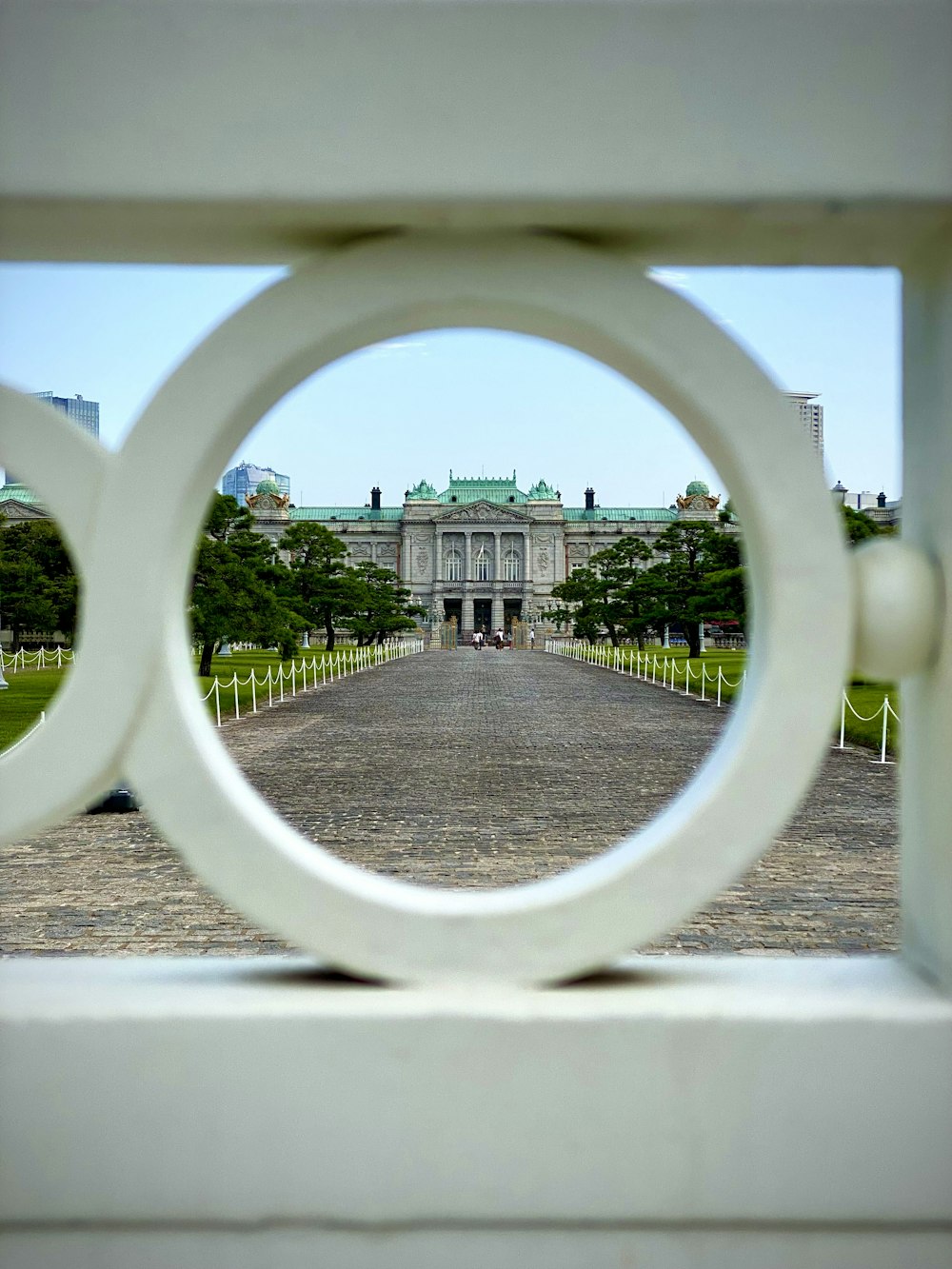 a view of a building through a circular window