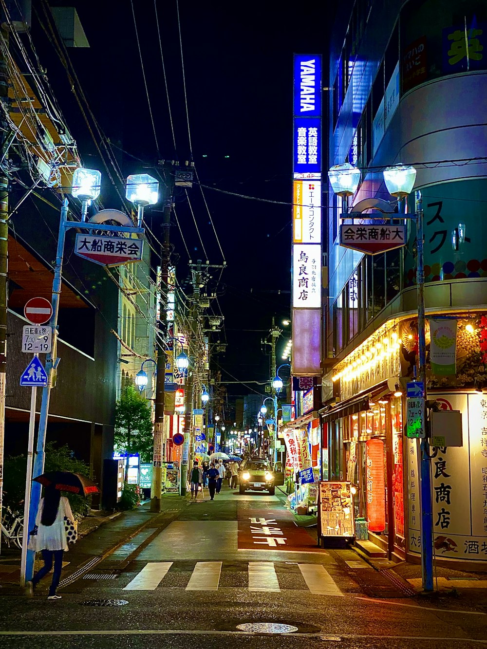 a city street is lit up at night