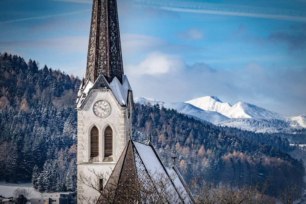 a church steeple with a clock on it