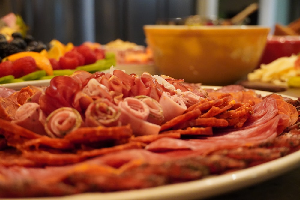 a plate of meat and vegetables on a table