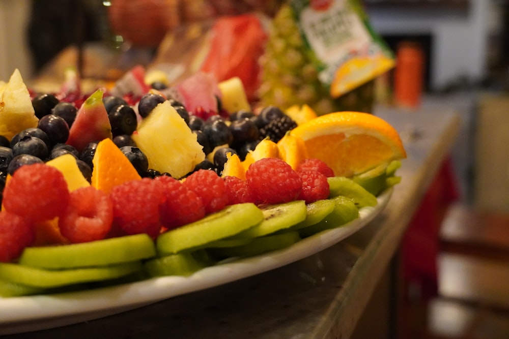 a plate of fruit is on a table