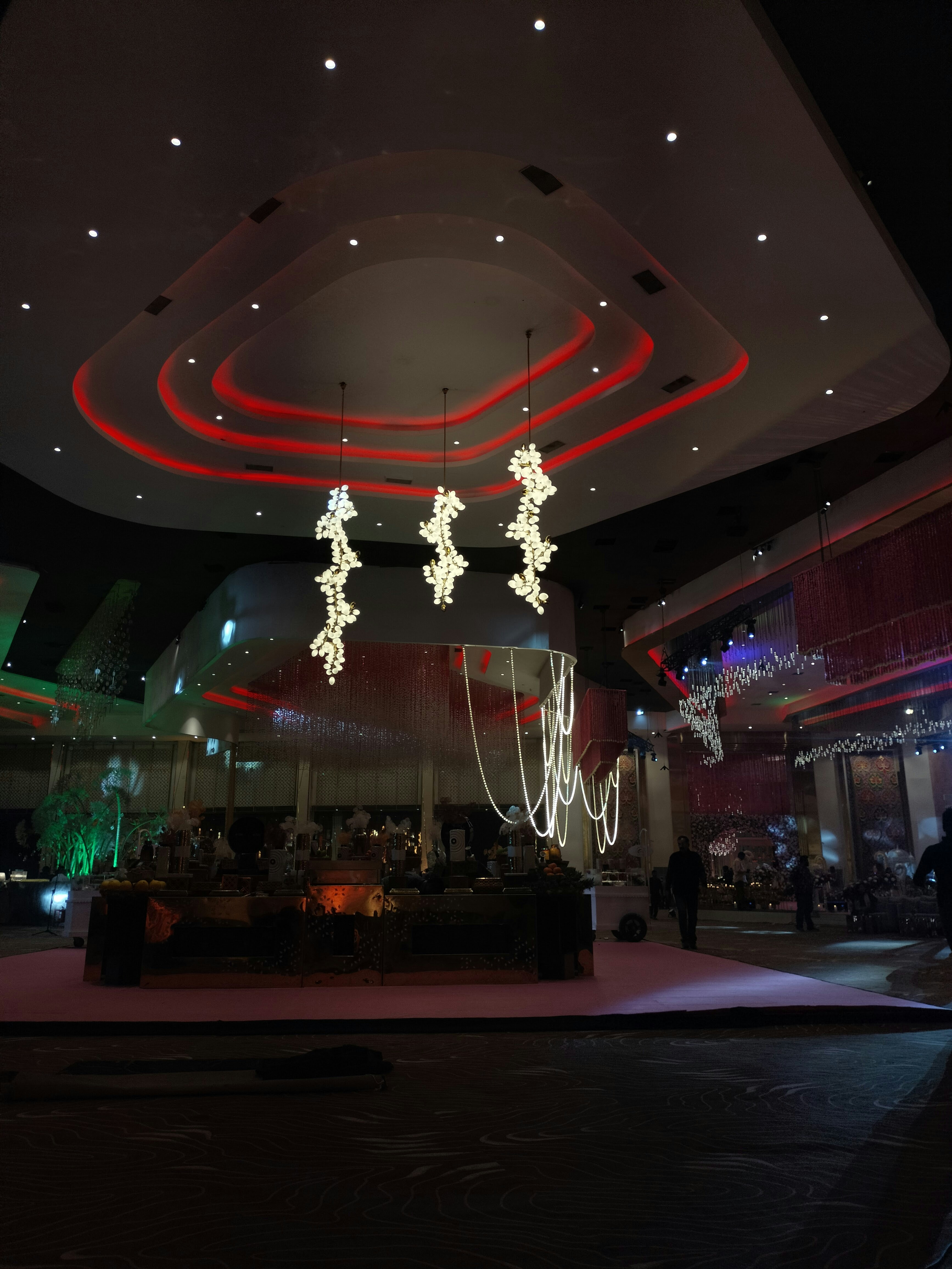Large modern event venue interior, bright lighting, open floor space